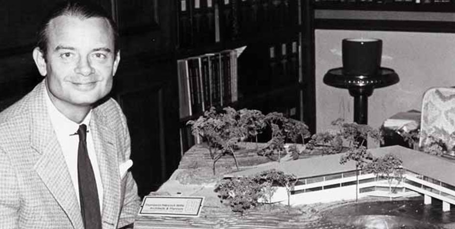 J. T. Stephens poses with mode of proposed EBSCO Industries Headquarters Building